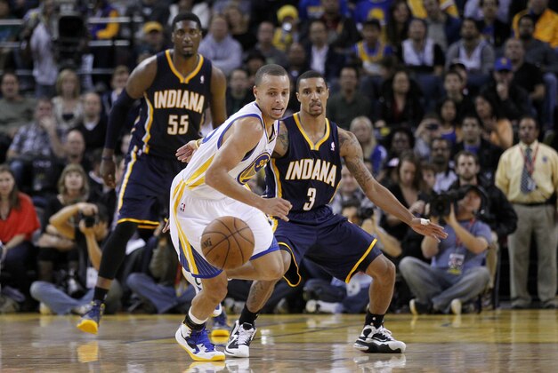 December 1, 2012; Oakland, CA, USA; Golden State Warriors guard Stephen Curry (30) tracks down a loose ball against the Indiana Pacers in the fourth quarter at ORACLE Arena. The Warriors defeated the Pacers, 103-92. Mandatory Credit: Cary Edmondson-USA TODAY Sports