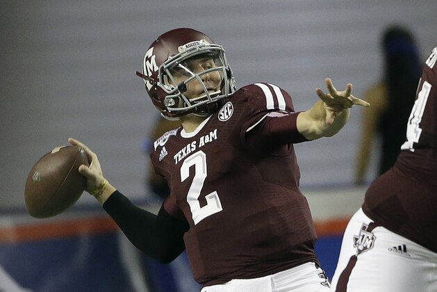 Texas A&M quarterback Johnny Manziel (2) looks for a receiver in the first half of the Chick-fil-A Bowl NCAA college football game against Duke Tuesday, Dec. 31, 2013, in Atlanta. (AP Photo/John Bazemore)