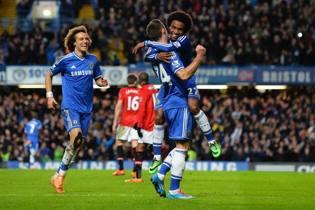LONDON, ENGLAND - JANUARY 19:  Gary Cahill #24 of Chelsea celebrates with teammates after his cross lead to Samuel Eto'o of Chelsea scoring their team's second goal during the Barclays Premier League match between Chelsea and Manchester United at Stamford Bridge on January 19, 2014 in London, England.  (Photo by Shaun Botterill/Getty Images)