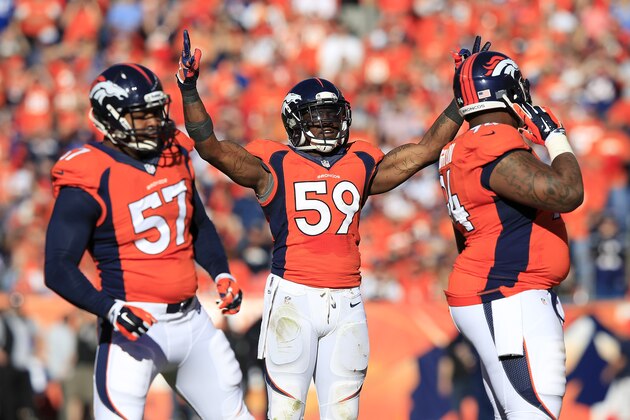 DENVER, CO - JANUARY 19:   Danny Trevathan #59 of the Denver Broncos reacts in the second quarter against the New England Patriots during the AFC Championship game at Sports Authority Field at Mile High on January 19, 2014 in Denver, Colorado.  (Photo by Jamie Squire/Getty Images)