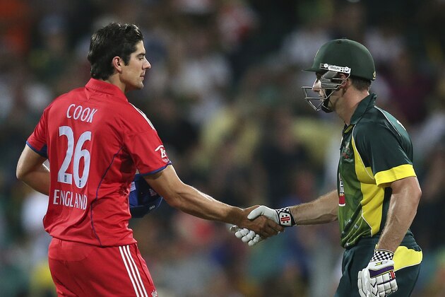 England captain Alastair Cook, left, shakes hands with Australia Shaun Marsh After their one-day international cricket match at the Sydney Cricket Ground in Sydney, Australia, Sunday, Jan. 19, 2014. Australia won the match by seven wickets. (AP Photo/Rob Griffith)