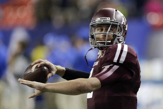 Texas A&M quarterback Johnny Manziel (2) warms up before the start of the Chick-fil-A Bowl NCAA college football game against Duke Tuesday, Dec. 31, 2013, in Atlanta. (AP Photo/John Bazemore)