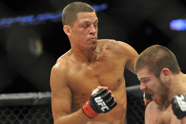 May 5, 2012; East Rutherford, NJ, USA;  Nate Diaz (left) and Jim Miller fight during their lightweight bout during UFC on Fox 3 at the Izod Center. Nate Diaz wins by submission in round two Mandatory Credit: Joe Camporeale-USA TODAY Sports