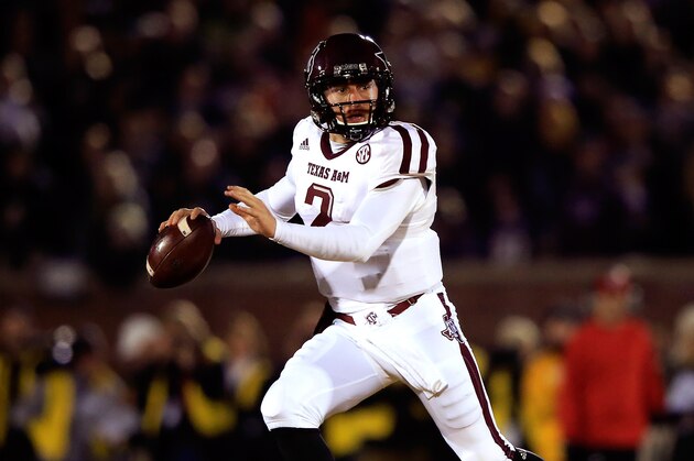 COLUMBIA, MO - NOVEMBER 30:  Quarterback Johnny Manziel #2 of the Texas A&M Aggies scrambles during the game against the Missouri Tigers on November 30, 2013 in Columbia, Missouri.  (Photo by Jamie Squire/Getty Images)