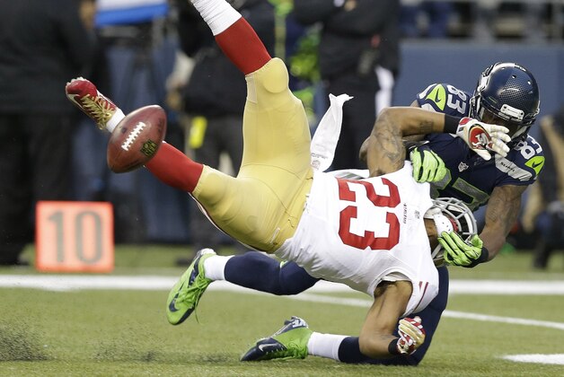 San Francisco 49ers' LaMichael James fumbles as he is hit by Seattle Seahawks' Ricardo Lockette (83) on a kick off during the first half of the NFL football NFC Championship game Sunday, Jan. 19, 2014, in Seattle. The 49ers recovered the fumble. (AP Photo/Elaine Thompson) San Francisco 49ers' LaMichael James fumbles as he is hit by Seattle Seahawks' Ricardo Lockette (83) on a kick off during the first half of the NFL football NFC Championship game Sunday, Jan. 19, 2014, in Seattle. The 49ers recovered the fumble. (AP Photo/Elaine Thompson)