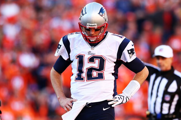 DENVER, CO - JANUARY 19:  Tom Brady #12 of the New England Patriots reacts in the fourth quarter against the Denver Broncos during the AFC Championship game at Sports Authority Field at Mile High on January 19, 2014 in Denver, Colorado.  (Photo by Elsa/Getty Images)