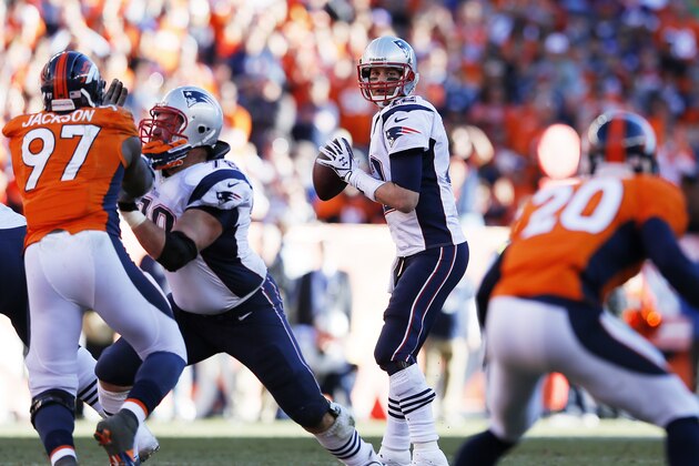 DENVER, CO - JANUARY 19:   Tom Brady #12 of the New England Patriots looks to pass against the Denver Broncos during the AFC Championship game at Sports Authority Field at Mile High on January 19, 2014 in Denver, Colorado.  (Photo by Kevin C. Cox/Getty Images)