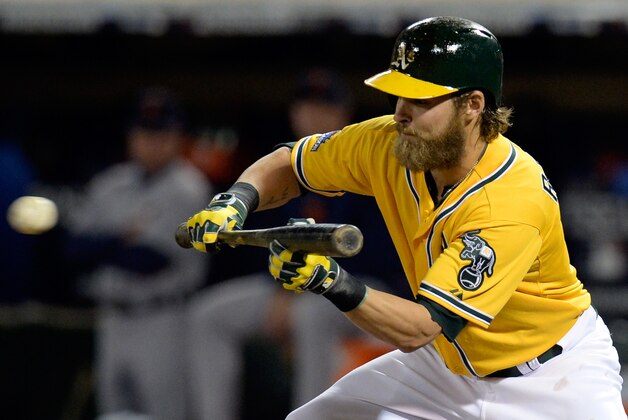 OAKLAND, CA - OCTOBER 05:  Josh Reddick #16 of the Oakland Athletics bunts the ball in the sixth inning against the Detroit Tigers during Game Two of the American League Division Series at O.co Coliseum on October 5, 2013 in Oakland, California.  (Photo by Thearon W. Henderson/Getty Images)