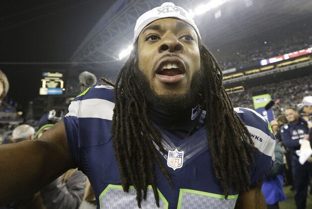 Seattle Seahawks' Richard Sherman celebrates after the NFL football NFC Championship game against the San Francisco 49ers, Sunday, Jan. 19, 2014, in Seattle. The Seahawks won 23-17 to advance to Super Bowl XLVIII. (AP Photo/Elaine Thompson)
