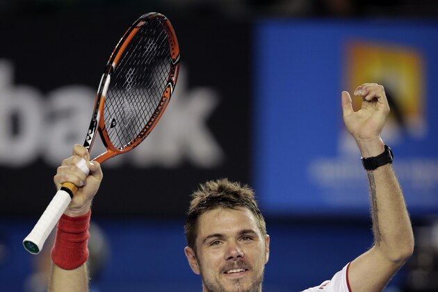 Stanislas Wawrinka of Switzerland celebrates after defeating Tommy Robredo of Spain during their fourth round match at the Australian Open tennis championship in Melbourne, Australia, Sunday, Jan. 19, 2014.(AP Photo/Rick Rycroft)