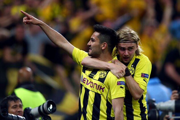 LONDON, ENGLAND - MAY 25:  Ilkay Gundogan of Borussia Dortmund (L) celebrates with team-mate Marcel Schmelzer after scoring a goal from the penalty spot during the UEFA Champions League final match between Borussia Dortmund and FC Bayern Muenchen at Wembley Stadium on May 25, 2013 in London, United Kingdom.  (Photo by Alex Grimm/Getty Images)