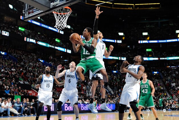 Oct 20, 2013; Montreal, Quebec, CAN; Boston Celtics guard MarShon Brooks (12) goes up while Minnesota Timberwolves center Chris Johnson (3) defends during the third quarter at the Bell Centre. Mandatory Credit: Eric Bolte-USA TODAY Sports Oct 20, 2013; Montreal, Quebec, CAN; Boston Celtics guard MarShon Brooks (12) goes up while Minnesota Timberwolves center Chris Johnson (3) defends during the third quarter at the Bell Centre. Mandatory Credit: Eric Bolte-USA TODAY Sports