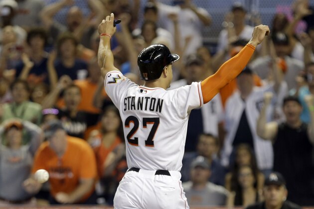 Miami Marlins' Giancarlo Stanton (27) scores the winning run against the Detroit Tigers in the ninth inning of an interleague  baseball game, Sunday, Sept. 29, 2013, in Miami. Stanton scored on a wild pitch by  Luke Putkonen. (AP Photo/Alan Diaz)