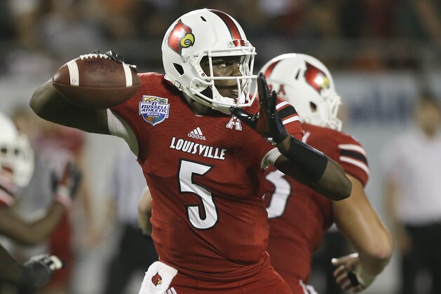 Louisville quarterback Teddy Bridgewater throws a pass during the first half of the Russell Athletic Bowl NCAA college football game against Miami in Orlando, Fla., Saturday, Dec. 28, 2013.(AP Photo/John Raoux)