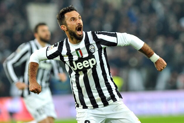 Juventus forward Mirko Vucinic, of Montenegro, celebrates after scoring during a Serie A soccer match between Juventus and AS Roma at the Juventus stadium, in Turin, Italy, Sunday, Jan. 5, 2014. (AP Photo/Massimo Pinca)