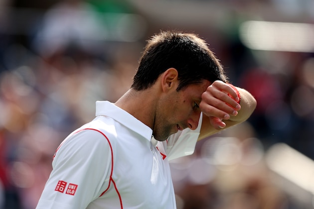 NEW YORK, NY - SEPTEMBER 07: Novak Djokovic of Serbia reacts during his men's singles semifinal match against Stanislas Wawrinka of Switzerland on Day Thirteen of the 2013 US Open at USTA Billie Jean King National Tennis Center on September 7, 2013 in the Flushing neighborhood of the Queens borough of New York City. (Photo by Clive Brunskill/Getty Images) NEW YORK, NY - SEPTEMBER 07: Novak Djokovic of Serbia reacts during his men's singles semifinal match against Stanislas Wawrinka of Switzerland on Day Thirteen of the 2013 US Open at USTA Billie Jean King National Tennis Center on September 7, 2013 in the Flushing neighborhood of the Queens borough of New York City. (Photo by Clive Brunskill/Getty Images)