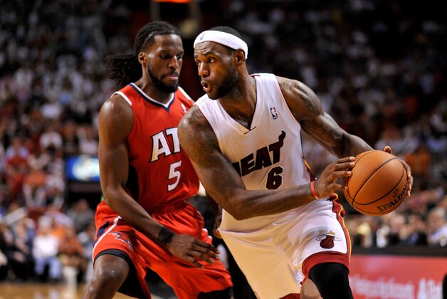 Nov 19, 2013; Miami, FL, USA; Miami Heat small forward LeBron James (6) drives to the basket as Atlanta Hawks small forward DeMarre Carroll (5) defends during the second half at American Airlines Arena. Mandatory Credit: Steve Mitchell-USA TODAY Sports