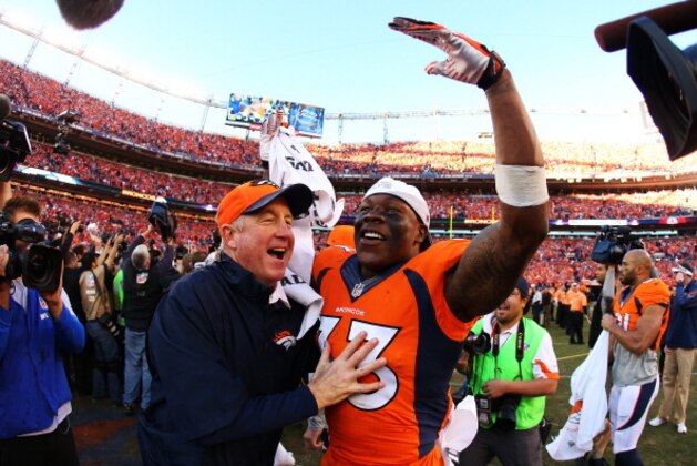DENVER, CO - JANUARY 19:   Duke Ihenacho #33 of the Denver Broncos celebrates with head coach John Fox after they defeated the New England Patriots 26 to 16 during the AFC Championship game at Sports Authority Field at Mile High on January 19, 2014 in Denver, Colorado.  (Photo by Justin Edmonds/Getty Images)