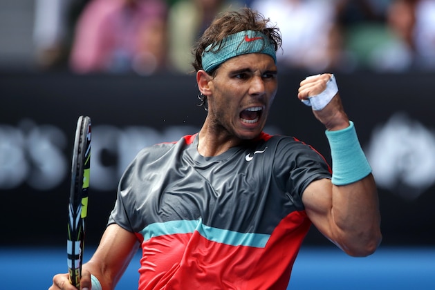 Rafael Nadal of Spain celebrates a point won against Kei Nishikori of Japan during their fourth round match at the Australian Open tennis championship in Melbourne, Australia, Monday, Jan. 20, 2014.(AP Photo/Aaron Favila)
