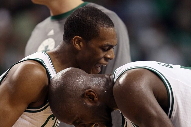 BOSTON, MA - MAY 12: Kevin Garnett #5 and Rajon Rondo #9 of the Boston Celtics celebrate Garnett's basket as they head into a time out against the Philadelphia 76ers in Game One of the Eastern Conference Semifinals in the 2012 NBA Playoffs on May 12, 2012 at TD Garden in Boston, Massachusetts. The Boston Celtics defeated the Philadelphia 76ers 92-91. NOTE TO USER: User expressly acknowledges and agrees that, by downloading and or using this photograph, User is consenting to the terms and conditions of the Getty Images License Agreement.  (Photo by Elsa/Getty Images)
