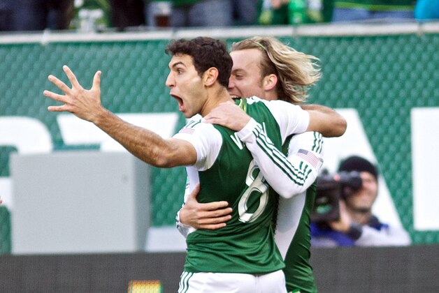 March 3, 2013; Portland, OR, USA; Portland Timbers midfielder Diego Valeri (8) celebrates with teammates after scoring the Timbers' first goal against New York Red Bulls to tie the game 1-1 in the first half at Jeld-Wen Field.  Mandatory Credit: Jaime Valdez-USA TODAY Sports