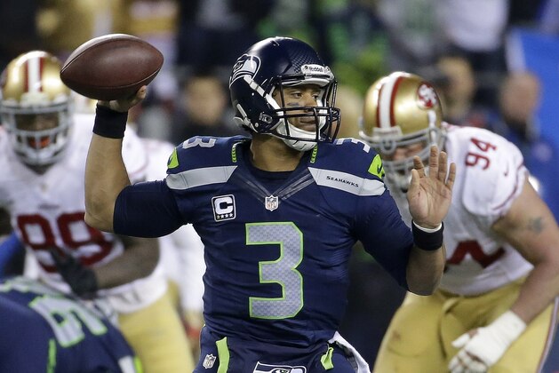 Seattle Seahawks' Russell Wilson throws during the second half of the NFL football NFC Championship game against the San Francisco 49ers, Sunday, Jan. 19, 2014, in Seattle. (AP Photo/Ted S. Warren)