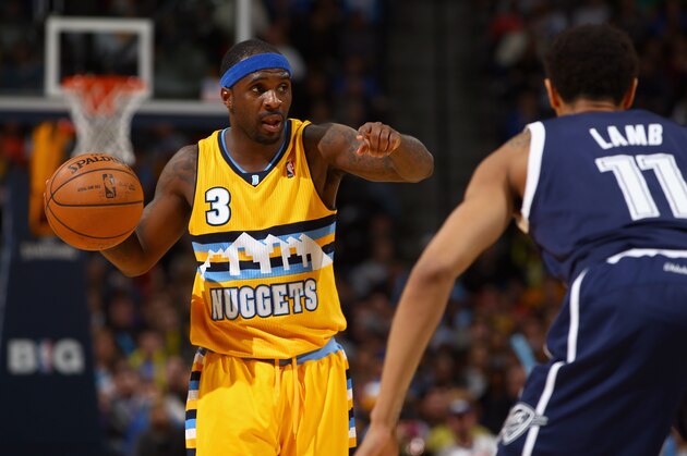 DENVER, CO - JANUARY 09:  Ty Lawson #3 of the Denver Nuggets controls the ball against Jeremy Lamb #11 of the Oklahoma City Thunder at Pepsi Center on January 9, 2014 in Denver, Colorado. The Nuggets defeated the Thunder 101-88. NOTE TO USER: User expressly acknowledges and agrees that, by downloading and or using this photograph, User is consenting to the terms and conditions of the Getty Images License Agreement.  (Photo by Doug Pensinger/Getty Images)