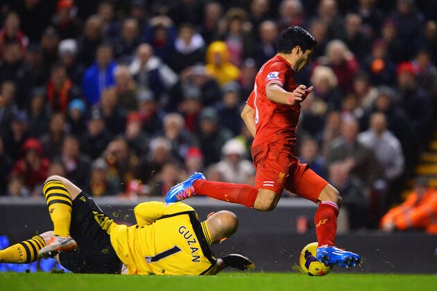 LIVERPOOL, ENGLAND - JANUARY 18:  Luis Suarez of Liverpool goes to ground after a challenge by Brad Guzan of Aston Villa leading to a penalty during the Barclays Premier League match between Liverpool and Aston Villa at Anfield on January 18, 2014 in Liverpool, England.  (Photo by Michael Regan/Getty Images)
