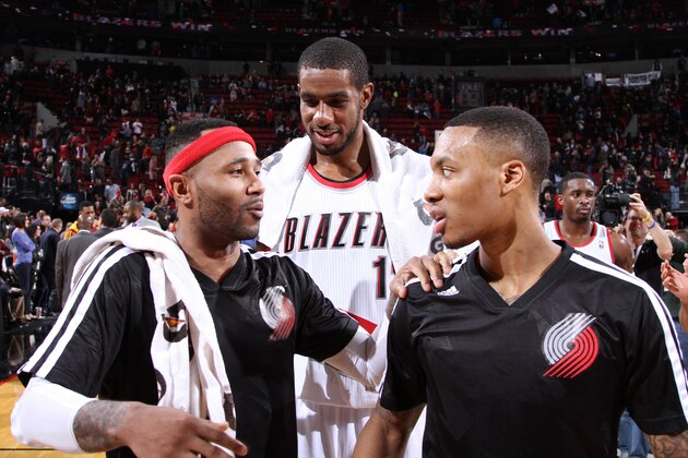 PORTLAND, OR - JANUARY 15:  LaMarcus Aldridge #12, Mo Williams #25 and Damian Lillard #0 of the Portland Trail Blazers smile and laugh after the game against the Cleveland Cavaliers on January 15, 2014 at the Moda Center Arena in Portland, Oregon. NOTE TO USER: User expressly acknowledges and agrees that, by downloading and or using this photograph, user is consenting to the terms and conditions of the Getty Images License Agreement. Mandatory Copyright Notice: Copyright 2014 NBAE (Photo by Sam Forencich/NBAE via Getty Images)