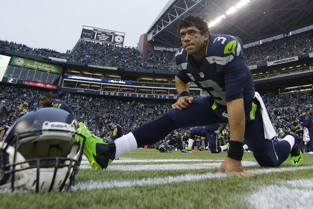Seattle Seahawks' Russell Wilson stretches before the NFL football NFC Championship game against the San Francisco 49ers Sunday, Jan. 19, 2014, in Seattle. (AP Photo/Matt Slocum)