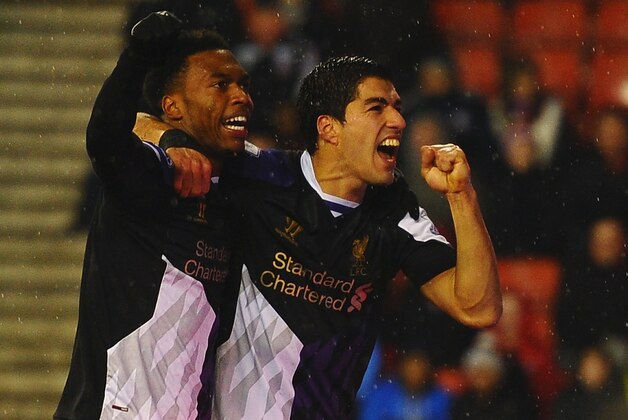 STOKE ON TRENT, ENGLAND - JANUARY 12:  Luis Suarez of Liverpool celebrates with Daniel Sturridge (L) as he scores their fourth goal during the Barclays Premier League match between Stoke City and Liverpool at Britannia Stadium on January 12, 2014 in Stoke on Trent, England.  (Photo by Laurence Griffiths/Getty Images)