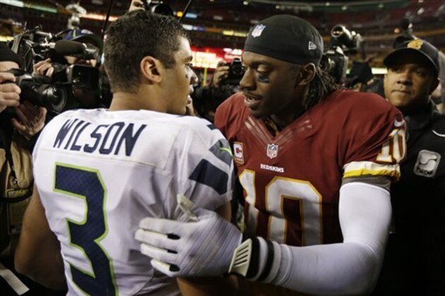 Seattle Seahawks quarterback Russell Wilson greets Washington Redskins quarterback Robert Griffin III after an NFL wild card playoff football game in Landover, Md., Sunday, Jan. 6, 2013. The Seahawks defeated the Redskins 24-14. (AP Photo/Evan Vucci)