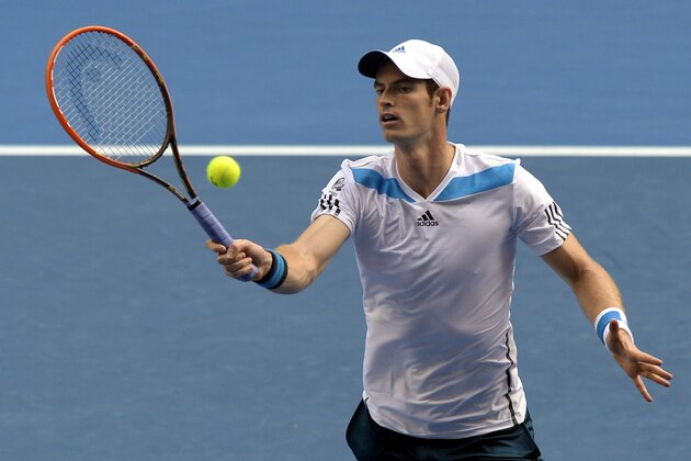 Andy Murray of Britain makes a forehand return to Stephane Robert of France during their fourth round match at the Australian Open tennis championship in Melbourne, Australia, Monday, Jan. 20, 2014.(AP Photo/Andrew Brownbill)