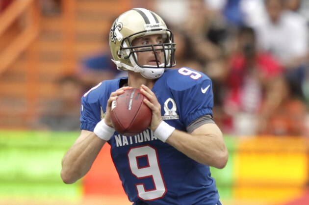 New Orleans Saints quarterback Drew Brees (9) of the NFC looks for an open receiver in the first quarter of the NFL Pro Bowl football game in Honolulu, Sunday, Jan. 27, 2013. (AP Photo/Eugene Tanner)
