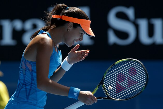 Ana Ivanovic of Serbia celebrates her win over Serena Williams of the U.S. during their fourth round match at the Australian Open tennis championship in Melbourne, Australia, Sunday, Jan. 19, 2014.(AP Photo/Aaron Favila)