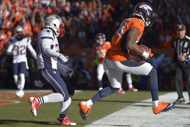 Denver Broncos wide receiver Demaryius Thomas (88) runs into the end zone on a three-yard touchdown pass against New England Patriots cornerback Alfonzo Dennard during the second half of the AFC Championship NFL playoff football game in Denver, Sunday, Jan. 19, 2014. (AP Photo/Jack Dempsey)