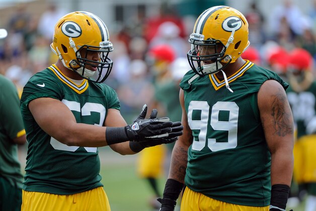 June 12, 2012; Green Bay, WI, USA;   Green Bay Packers linebacker Nick Perry (53) and defensive end Jerel Worthy (99) during the team's mandatory minicamp at Ray Nitschke Field.  Mandatory Credit: Benny Sieu-USA TODAY Sports
