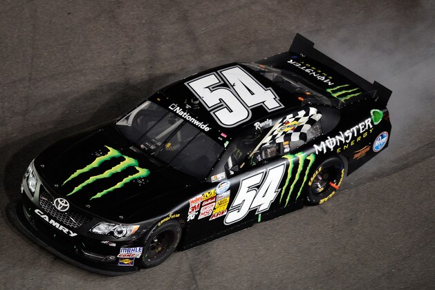 BRISTOL, TN - AUGUST 23:  Kyle Busch, driver of the #54 Monster Energy Toyota, celebrates with a burnout after winning the NASCAR Nationwide Series Food City 250 at Bristol Motor Speedway on August 23, 2013 in Bristol, Tennessee.  (Photo by Jared C. Tilton/Getty Images)