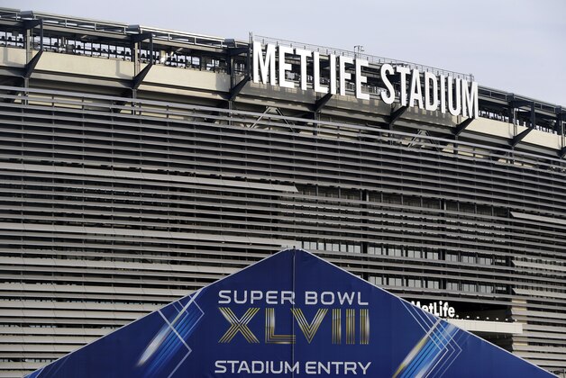 A tent, which will serve as an access point into MetLife Stadium during Super Bowl XLVIII, is seen in front of the stadium, Wednesday, Jan. 15, 2014, in East Rutherford, N.J. Police officials say security for the Super Bowl will include about 4,000 government and private officers assigned to the stadium on game day. Fans arriving at the game by mass transit on Feb. 2 will encounter a security perimeter extending 300 feet from entrances to the stadium. They'll be funneled into temporary pavilions for airport-style screening. (AP Photo/Julio Cortez)