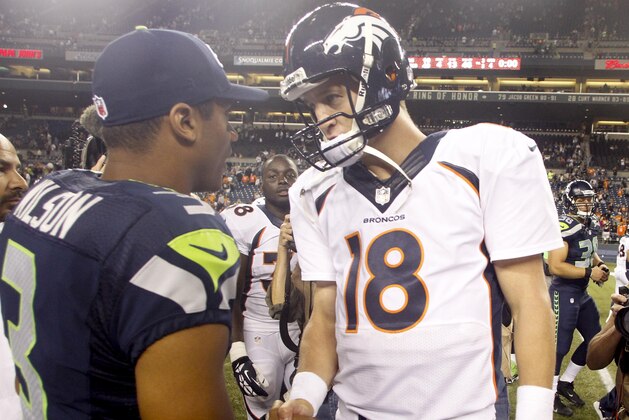 Aug 17, 2013; Seattle, WA, USA; Seattle Seahawks quarterback Russell Wilson (3) and Denver Broncos quarterback Peyton Manning (18) speak following a 40-10 preseason victory by the Seahawks at CenturyLink Field. Mandatory Credit: Joe Nicholson-USA TODAY Sports Aug 17, 2013; Seattle, WA, USA; Seattle Seahawks quarterback Russell Wilson (3) and Denver Broncos quarterback Peyton Manning (18) speak following a 40-10 preseason victory by the Seahawks at CenturyLink Field. Mandatory Credit: Joe Nicholson-USA TODAY Sports