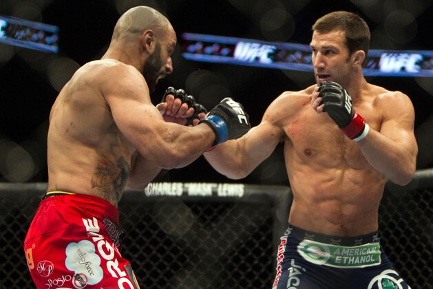 Jan 15, 2014; Duluth, GA, USA; Luke Rockhold (red gloves) fights Costas Philippou (blue gloves) during UFC Fight Night at Gwinnett Center. Rockhold wins. Mandatory Credit: Joshua S. Kelly-USA TODAY Sports