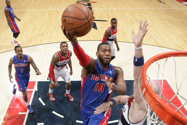 WASHINGTON, DC - JANUARY 18: Greg Monroe #10 of the Detroit Pistons shoots against Marcin Gortat #4 of the Washington Wizards during the game at the Verizon Center on January 18, 2014 in Washington, DC. NOTE TO USER: User expressly acknowledges and agrees that, by downloading and or using this photograph, User is consenting to the terms and conditions of the Getty Images License Agreement. Mandatory Copyright Notice: Copyright 2014 NBAE (Photo by Ned Dishman/NBAE via Getty Images)