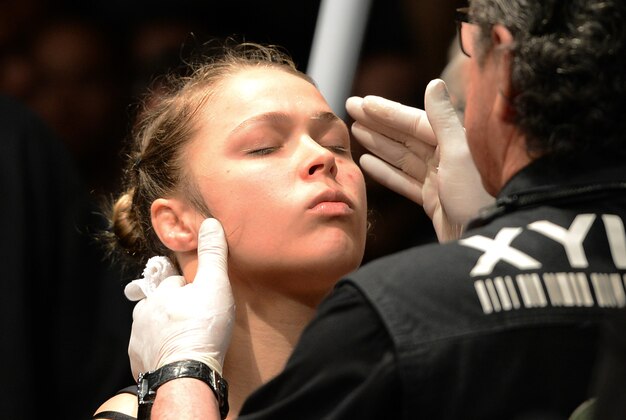 Dec 28, 2013; Las Vegas, NV, USA;   Ronda Rousey gets ready to enter the cage for her UFC Women's Bantamweight Championship Bout against Miesha Tate (not pictured) at the MGM Grand Garden Arena. Rousey won. Mandatory Credit: Jayne Kamin-Oncea-USA TODAY Sports