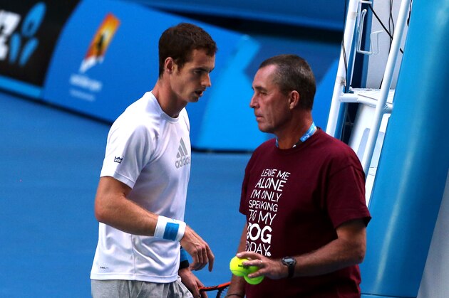 Andy Murray of Britain, left,  walks past his coach Ivan Lendl during a training session on the Rod Laver Arena, at the Australian Open tennis championship in Melbourne, Australia, Tuesday, Jan. 21, 2014.  Wimbledon champion Murray faces Roger Federer, winner of 17 Grand Slams, at the Australian Open quarterfinal Wednesday.(AP Photo/Shuji Kajiyama)