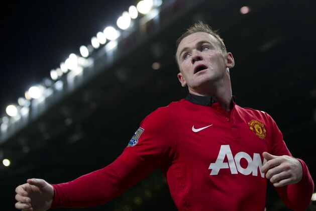 Manchester United's Wayne Rooney waits to take a corner during his team's English Premier League soccer match against Everton at Old Trafford Stadium, Manchester, England, Wednesday Dec. 4, 2013. (AP Photo/Jon Super) Manchester United's Wayne Rooney waits to take a corner during his team's English Premier League soccer match against Everton at Old Trafford Stadium, Manchester, England, Wednesday Dec. 4, 2013. (AP Photo/Jon Super)