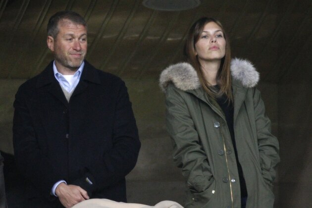 Russian billionaire Roman Abramovich, left, and his girlfriend Dasha Zhukova await the start of the Champions League soccer match between Chelsea and Spartak Moscow at the Luzhniki stadium in Moscow, Russia, Tuesday, Oct. 19, 2010. (AP Photo/Alexander Zemlianichenko)