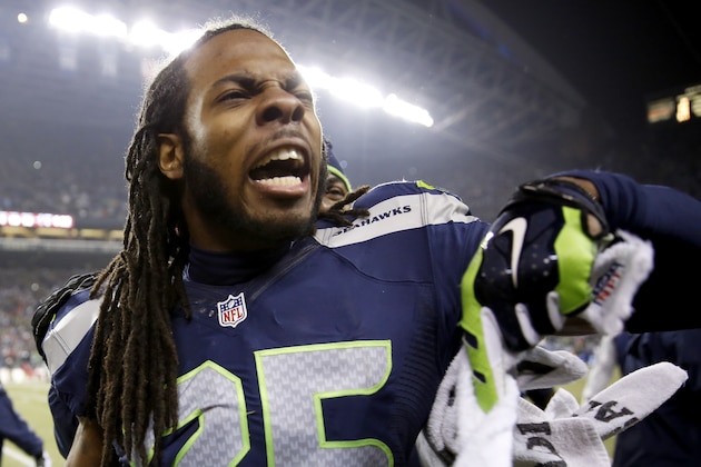 SEATTLE, WA - JANUARY 19:  Cornerback Richard Sherman #25 of the Seattle Seahawks reacts on the sideline after tipping a pass which led to a Seahawks game-clinching interception late in the fourth quarter against the San Francisco 49ers during the 2014 NFC Championship at CenturyLink Field on January 19, 2014 in Seattle, Washington.  (Photo by Otto Greule Jr/Getty Images)
