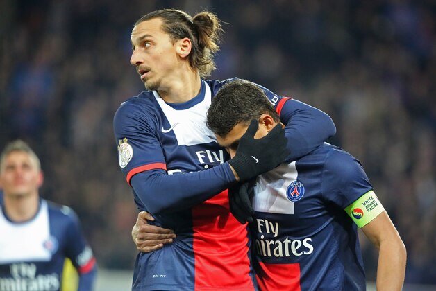 Paris Saint Germain's Zlatan Ibrahimovic of Sweden, left, congratulates Thiago Da Silva after he scored the opening goal, during the League One soccer match between Paris Saint Germain and Nantes at the Parc des Princes stadium in Paris, Sunday Jan. 19, 2014. (AP Photo/Remy de la Mauviniere)