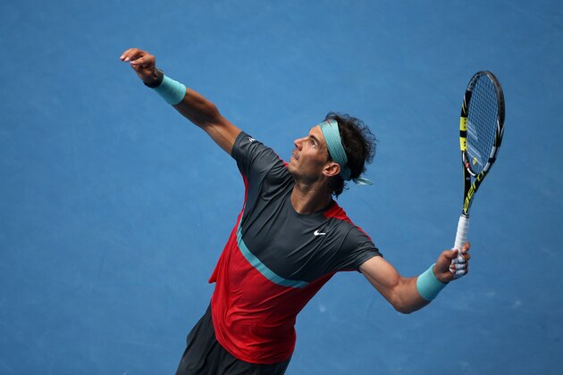 MELBOURNE, AUSTRALIA - JANUARY 20:  Rafael Nadal of Spain serves in his fourth round match against Kei Nishikori of Japan during day eight of the 2014 Australian Open at Melbourne Park on January 20, 2014 in Melbourne, Australia.  (Photo by Clive Brunskill/Getty Images)