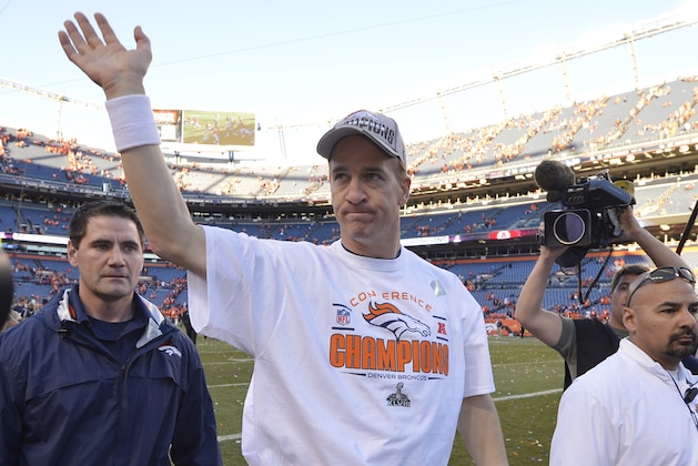 Denver Broncos quarterback Peyton Manning waves as he walks off the field after the AFC Championship NFL playoff football game in Denver, Sunday, Jan. 19, 2014. The Broncos defeated the Patriots 26-16 to advance to the Super Bowl. (AP Photo/Jack Dempsey)